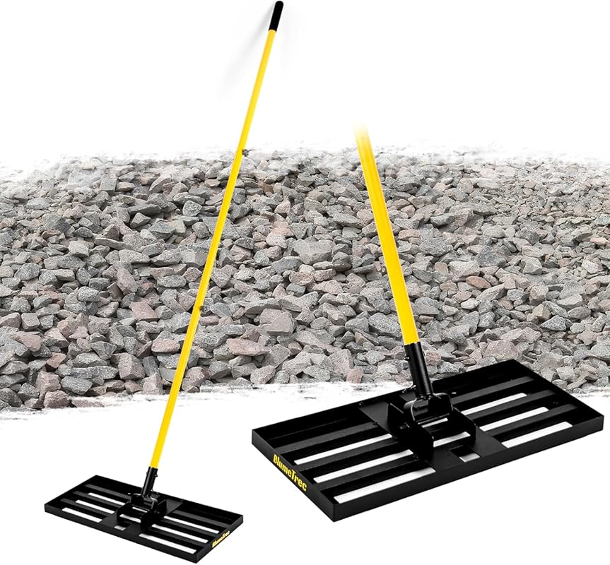 Top 3 Lawn Leveling Tools for Sloped Yards black landscape rake with yellow handle on gravel